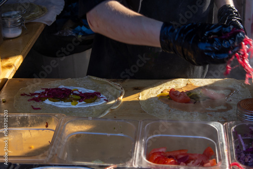 Chef Preparing Fresh Street Food Wraps at a Stall