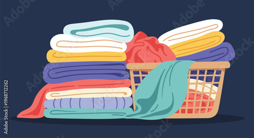 Large stack of neatly folded colorful clothes next to a full laundry basket against a dark navy blue background.
