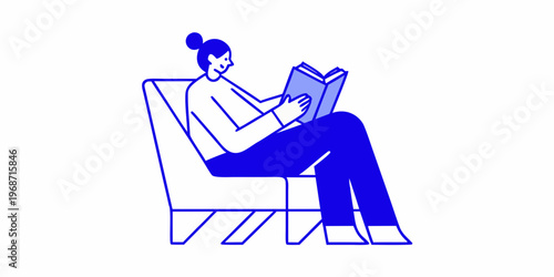 Woman comfortably reading a book while relaxing in a modern armchair