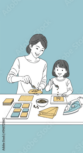 A mother and daughter working together to make sustainable beeswax food wraps