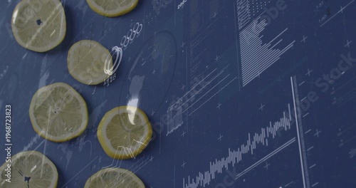 Displaying thin lemon slices lying flat on dark blue tabletop, with overlaid white graphs