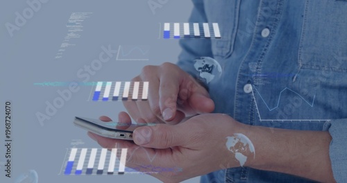 Tapping male hands using smartphone in studio, denim shirt showing data visualizations on screen