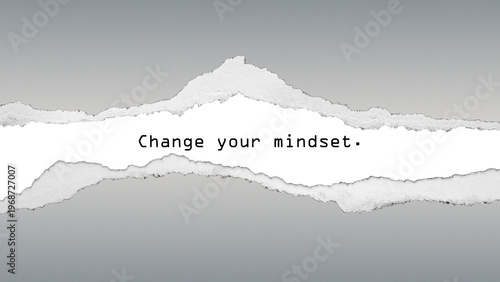 Powerful quote “Change your mindset” on grey gradient with torn paper effect, promoting transformation, growth, and new perspectives.