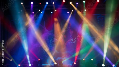 Stage lighting beams with colorful spotlights and haze at concert venue for musical events, live performances, nightclub parties, vibrant