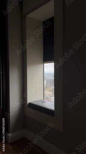 Window Seat Overlooking Cityscape Urban View Skyline Modern Living Apartment Perspective Travel Lifestyle Architecture High Rise Scenic City View 4K Video