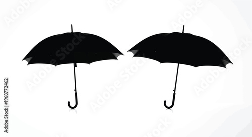 Two black umbrellas displayed against a white background stark contrast silhouette