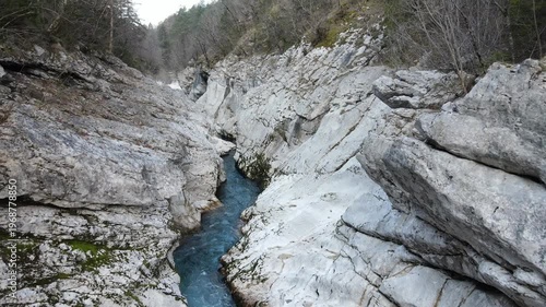 Aerial drone footage tilting from top down view of Soča river canyon to scenic alpine landscape in Slovenia