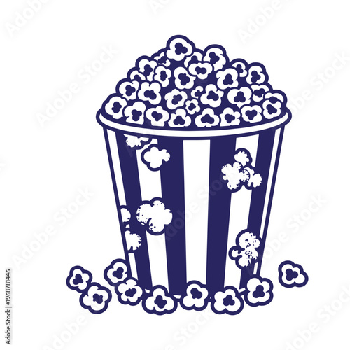 Dark blue and white of a striped popcorn bucket filled with fluffy popcorn kernels with some scattered on the ground isolated on a white background