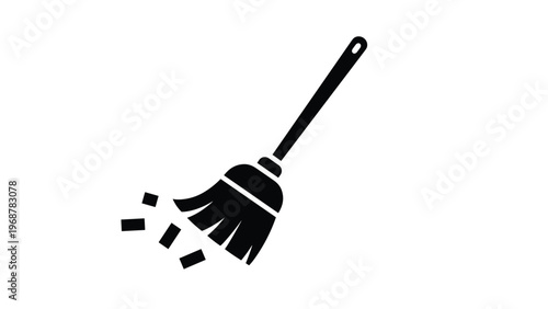 Black silhouette icon of a traditional broom sweeping up debris on a white background representing cleaning and maintenance.