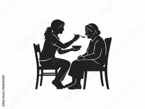 Young Woman Caregiver Feeding Elderly Woman Silhouette