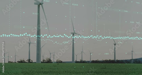 Wind turbines rotating, driven by wind, while teal data overlay animating to visualize power output
