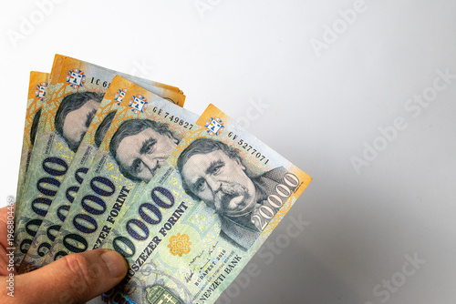 Hand holding Hungarian forint banknotes