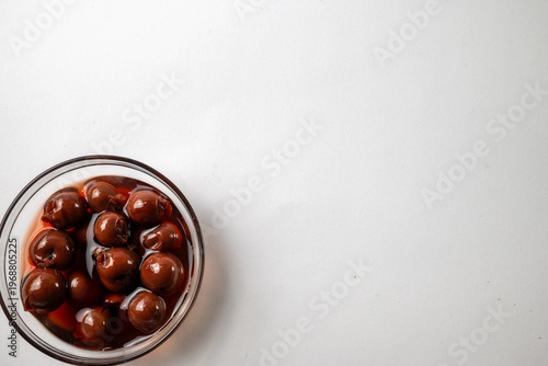 фотографія Sweet cherry compote in glass bowl