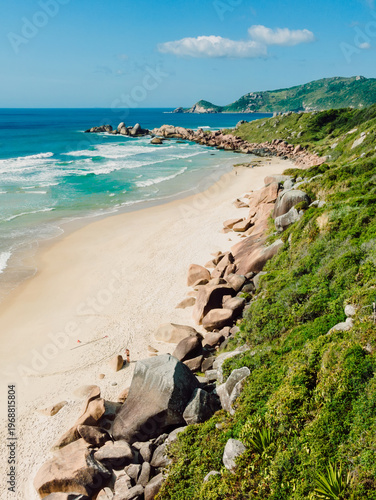 Scenic beach, rocks and ocean on sunny day in Brazil. Drone view of Praia da Galheta