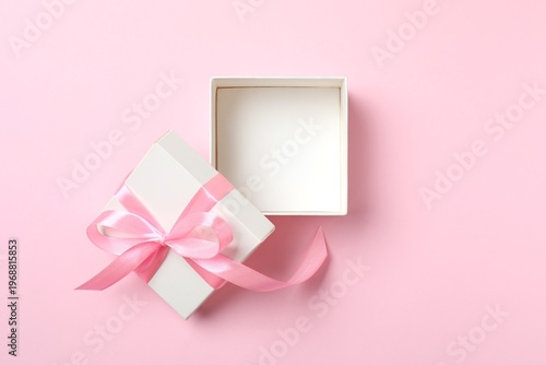Konstfotografi Open gift box on pink background. Top view