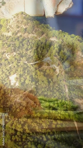 Vertical video: Aerial overlay shifting via camera glare, revealing bread and greens for food ads