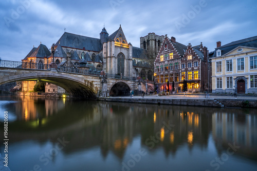 Quadro su tela Saint Michael's Church and Saint Michael's Bridge reflected in the Leie River, Ghent, Belgium
