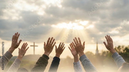 Group of people raising hands in praise and worship towards cross. Religious spiritual gathering under sunset sky. Christian faith, hope and belief concept. Community prayer service.
