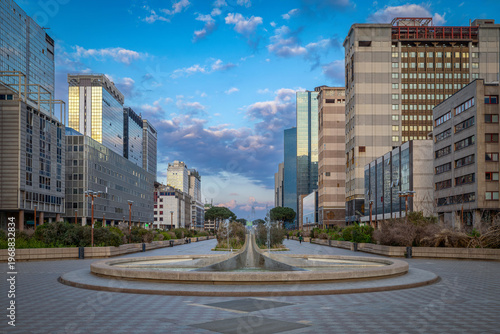Modern fountain and office towers in the Naples business district.