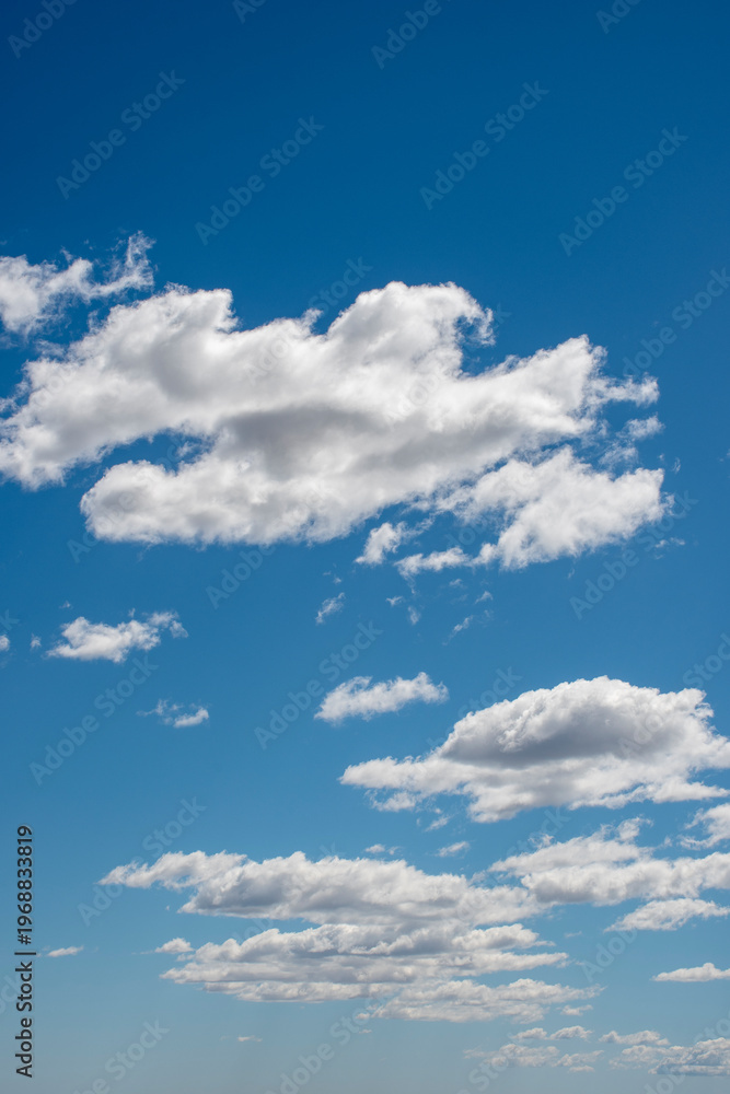 Fototapeta premium Blue sky with white clouds, cirrus, cumulus, stratus and nimbus.