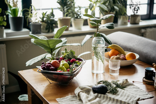 Big tray with different fresh fruits and vegetables on the table. Healthy organic food and eating at home concept.