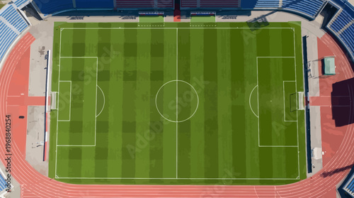 Aerial View of a Green Football Soccer Field in a Large Sports Stadium with Running Track and Grandstands