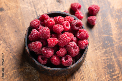 Raspberries in wooden bowl
