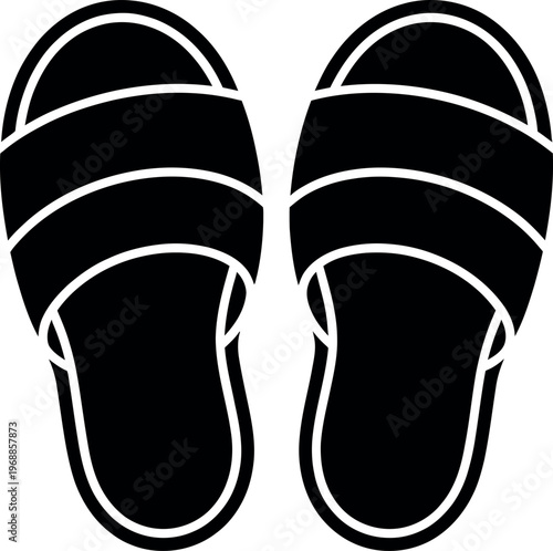 A pair of black slip-on slides with white accents and thick soles