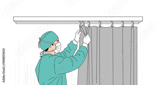 Medical staff in protective gear hangs privacy curtain in hospital room