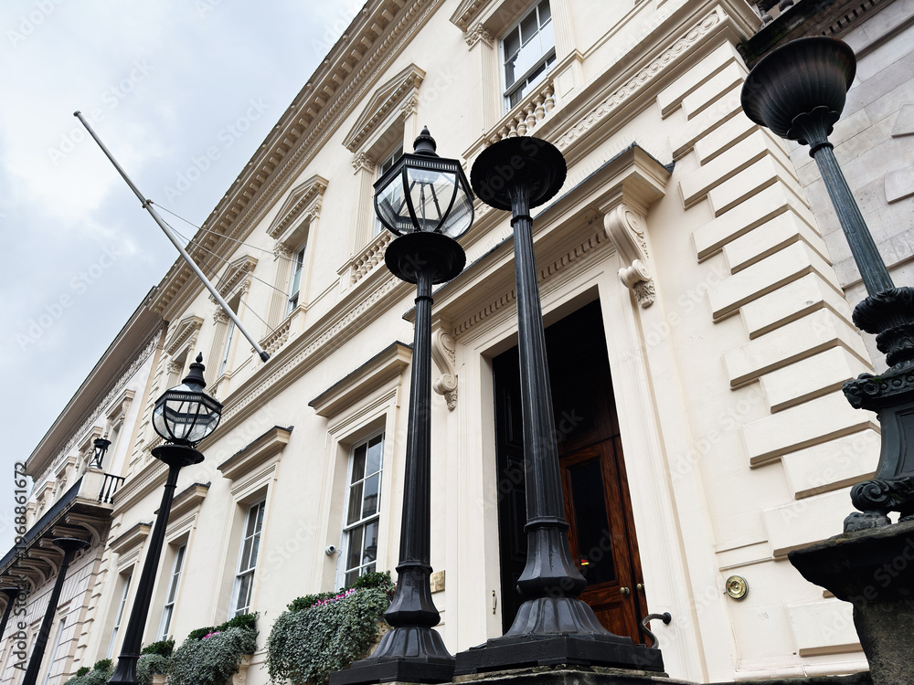 Fototapeta premium Historic London, UK townhouse facade with ornate lanterns and neoclassical architectural details