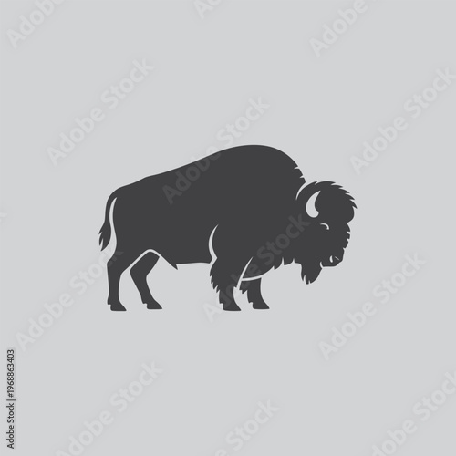 Bison silhouette with a dark gray silhouette of a bison against a light gray