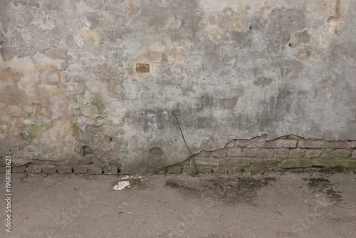 Weathered wall reveals stories of time and history on a quiet street corner in the heart of the city