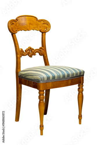 Elegant wooden chair with striped fabric sitting in a cozy room bringing charm and comfort