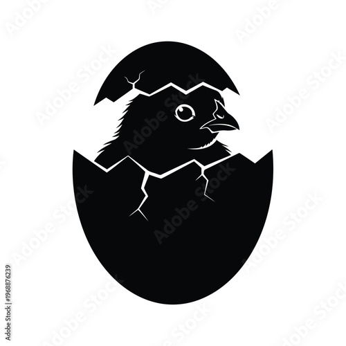 A baby bird emerges from a cracked eggshell in a natural environment.