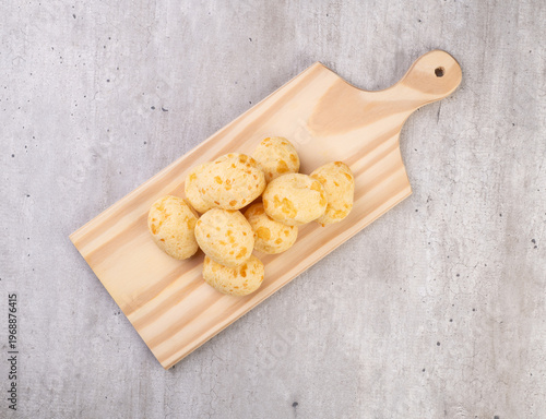Typical brazilian cheese bun over a wooden board