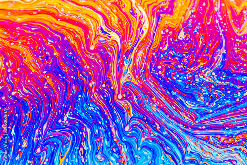 Close up on a soap bubble with random abstract forms and colors for background