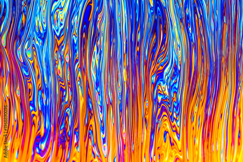 Close up on a soap bubble with random abstract forms and colors for background