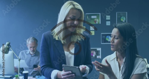 Animation of wifi icon and data processing over diverse business people in office