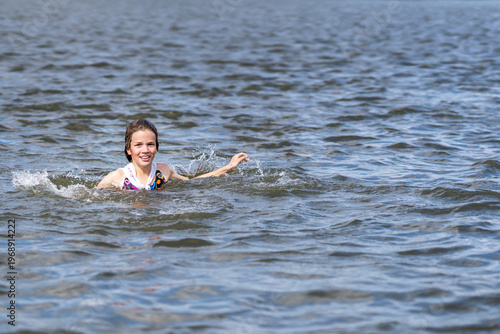child having fun in the sea