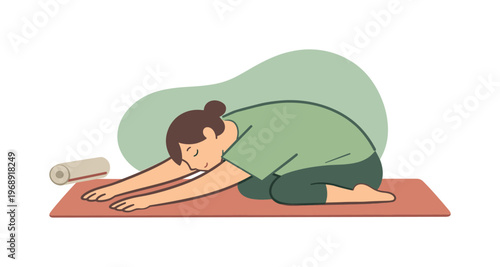 Woman in child's pose on yoga mat, embracing relaxation and mindfulness