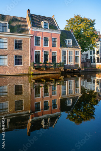 Pink House on Canal. Pretty, little pink house on a canal in Leiden, Netherlands.
