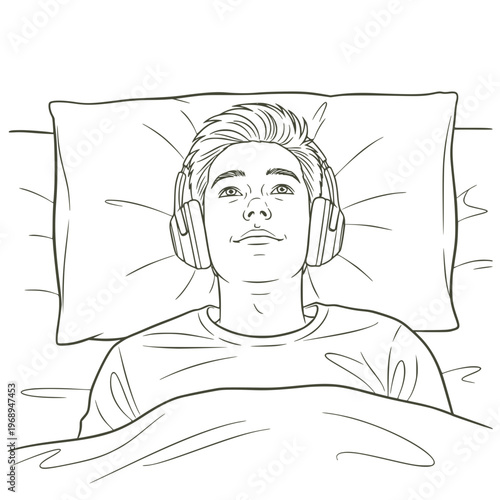 Young man lying in bed listening to music with headphones  