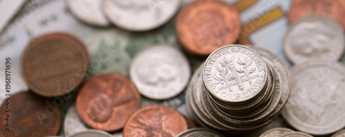 Photos Big amount of United States coins on hundred dollar money bills arranged in chao