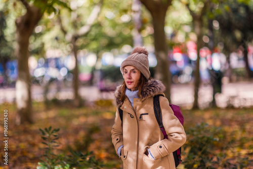Woman walking in park, contemplating thoughts. Eating disorder
