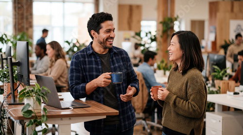 Colleagues talking over coffee during office break