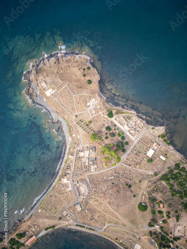 Aerial view of Nora ruins and sea at dawn