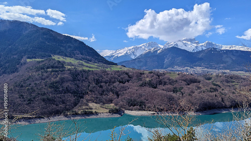 Picturesque Alpine Lake Landscape with Mountain Views and Blue Sky, France Alps Scenery