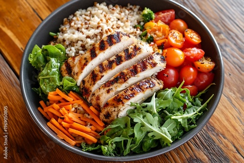 A nutritious bowl featuring grilled chicken, veggies, and grains.