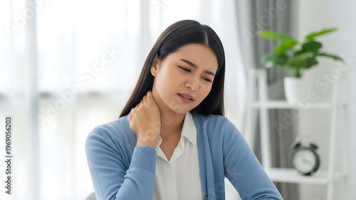Woman Experiencing Neck Pain in Modern Office Setting, Lifestyle Image, Indoor Environment, Personal Health Focus Free Download Woman Experiencing Neck Pain in Modern Office Setting, Lifestyle Image, Indoor Environment, Personal Health Focus - GFXLoad