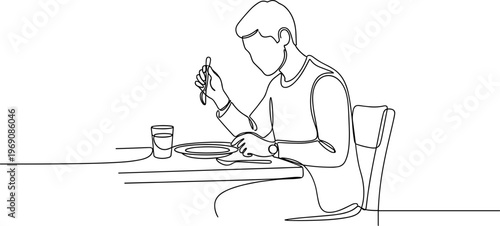 Man eating at a table alone.